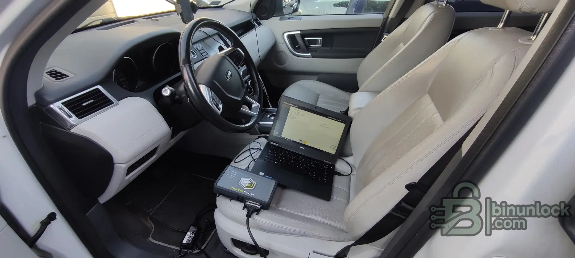 OBD ECU flashing setup with KESS3 connected inside the vehicle through the diagnostic port.